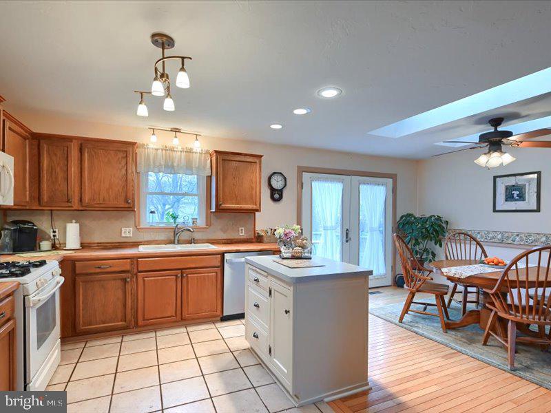 301 Larkin Drive Red Lion, PA 17356 - Photo 33 of 61 a large kitchen with cabinets chairs and wooden floor