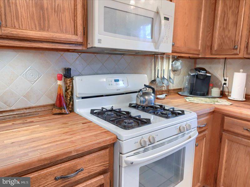 301 Larkin Drive Red Lion, PA 17356 - Photo 37 of 61 a kitchen with stainless steel appliances granite countertop a stove and a white cabinets