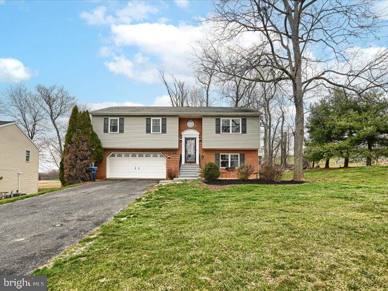 301 Larkin Drive Red Lion, PA 17356 - Photo 4 of 61 a house view with a garden space