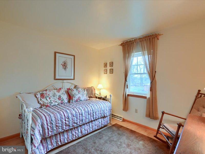 301 Larkin Drive Red Lion, PA 17356 - Photo 42 of 61 a bedroom with a bed and a mirror