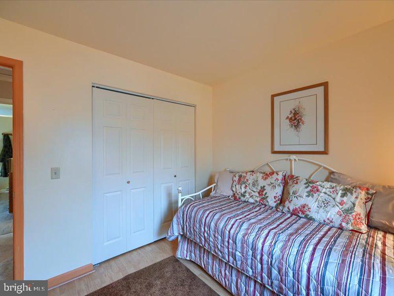 301 Larkin Drive Red Lion, PA 17356 - Photo 43 of 61 a bedroom with a bed and a painting on the wall