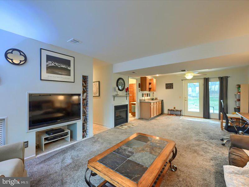 301 Larkin Drive Red Lion, PA 17356 - Photo 49 of 61 a living room with furniture and a flat screen tv