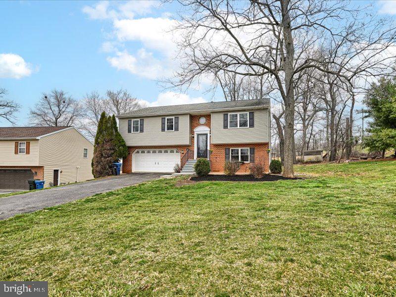 301 Larkin Drive Red Lion, PA 17356 - Photo 55 of 61 a view of a yard in front of a house with large trees