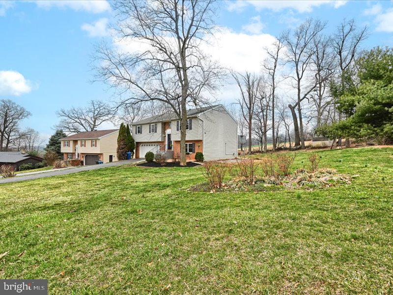 301 Larkin Drive Red Lion, PA 17356 - Photo 56 of 61 a white house that has a tree in front of it