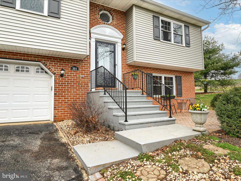 301 Larkin Drive Red Lion, PA 17356 - Photo 6 of 61 a front view of a house with a garage