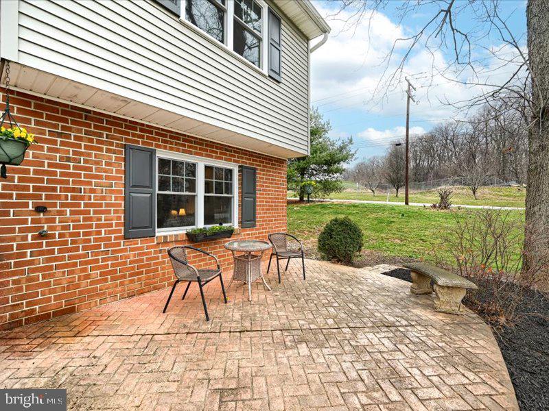 301 Larkin Drive Red Lion, PA 17356 - Photo 7 of 61 a backyard view of a house with a garden and patio