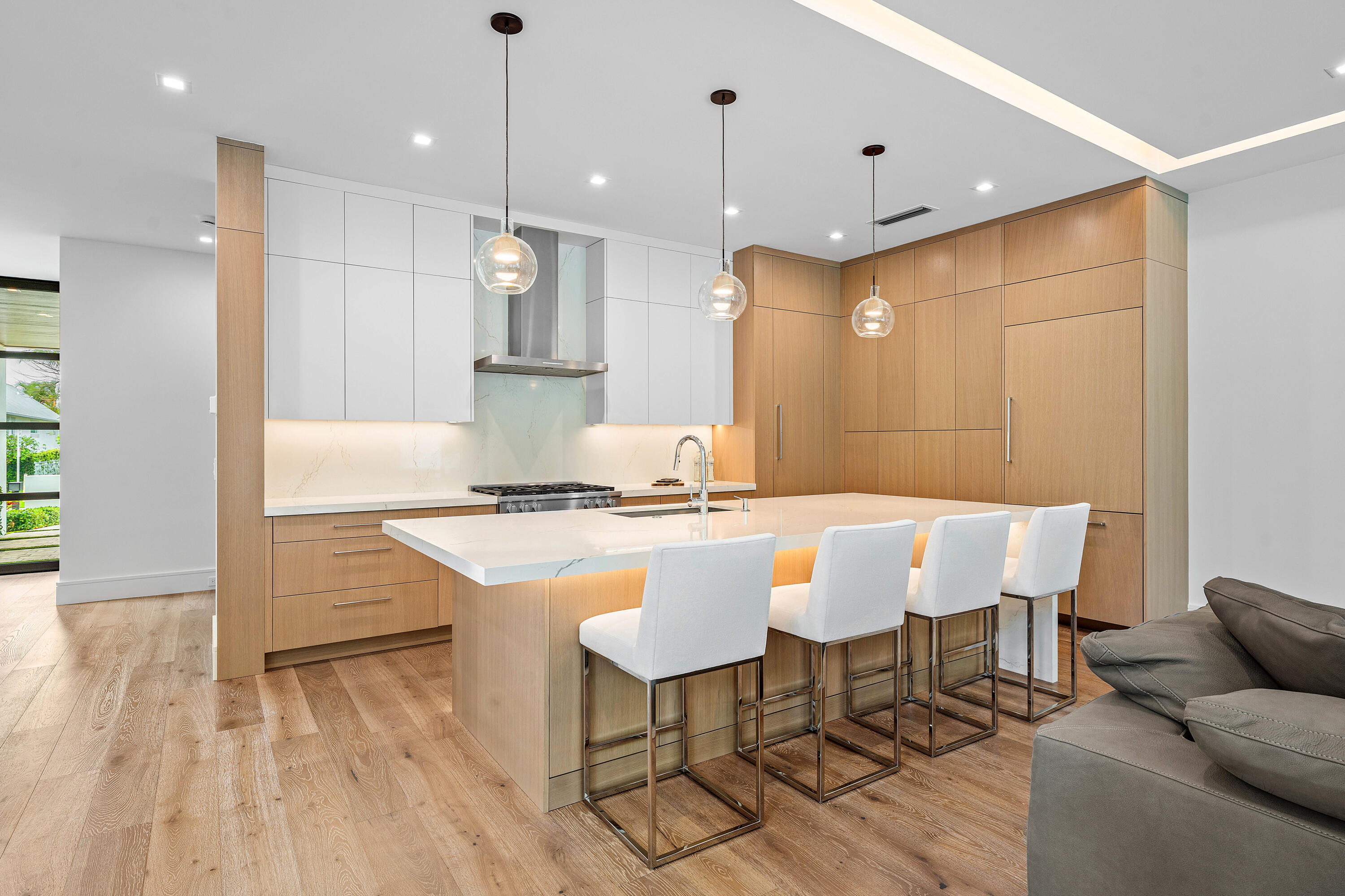 320 Northeast Wavecrest Way Boca Raton, FL 33432 - Photo 13 of 65 a large kitchen with kitchen island a island in it