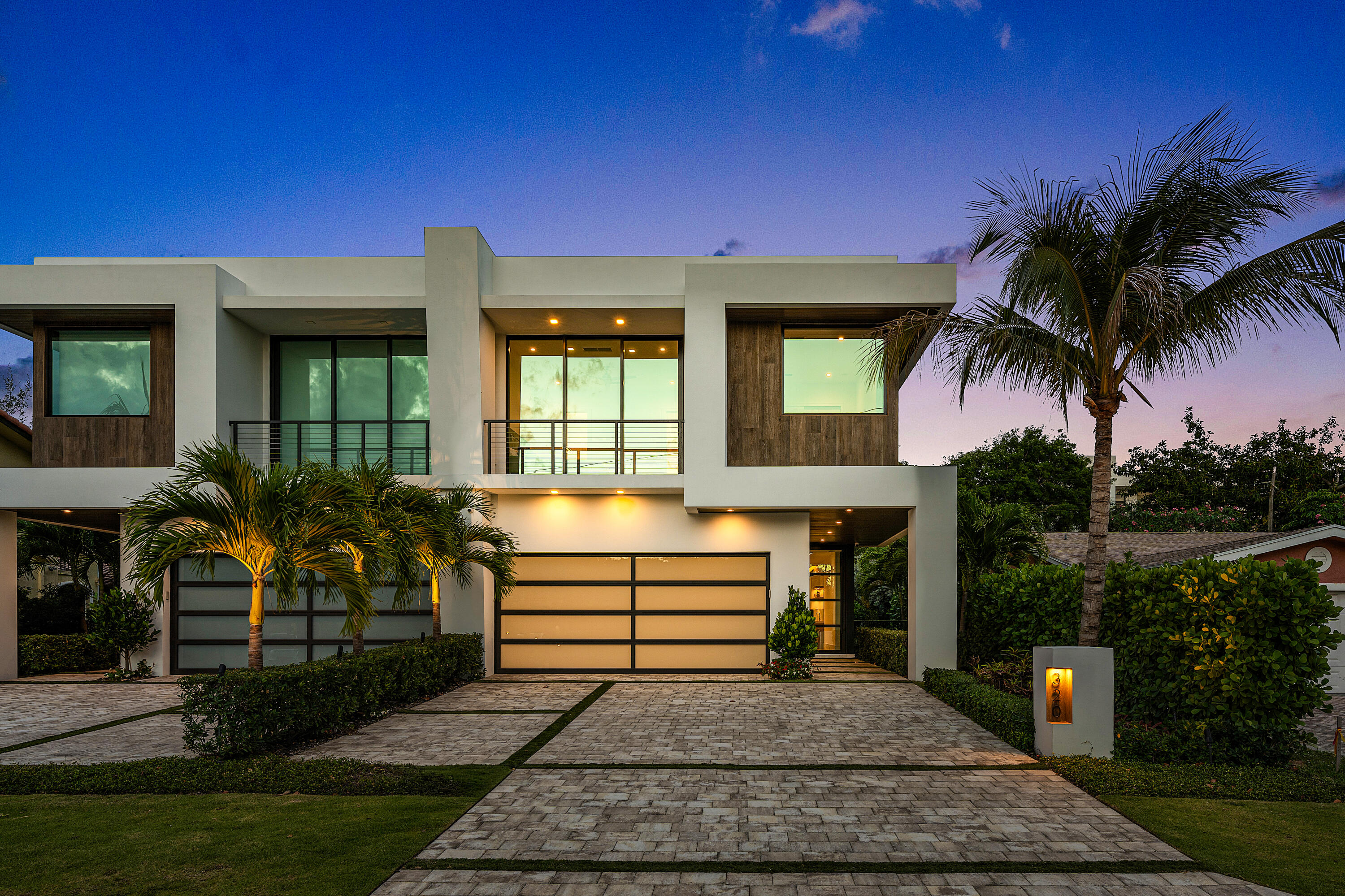 320 Northeast Wavecrest Way Boca Raton, FL 33432 - Photo 3 of 65 a front view of a house with garden