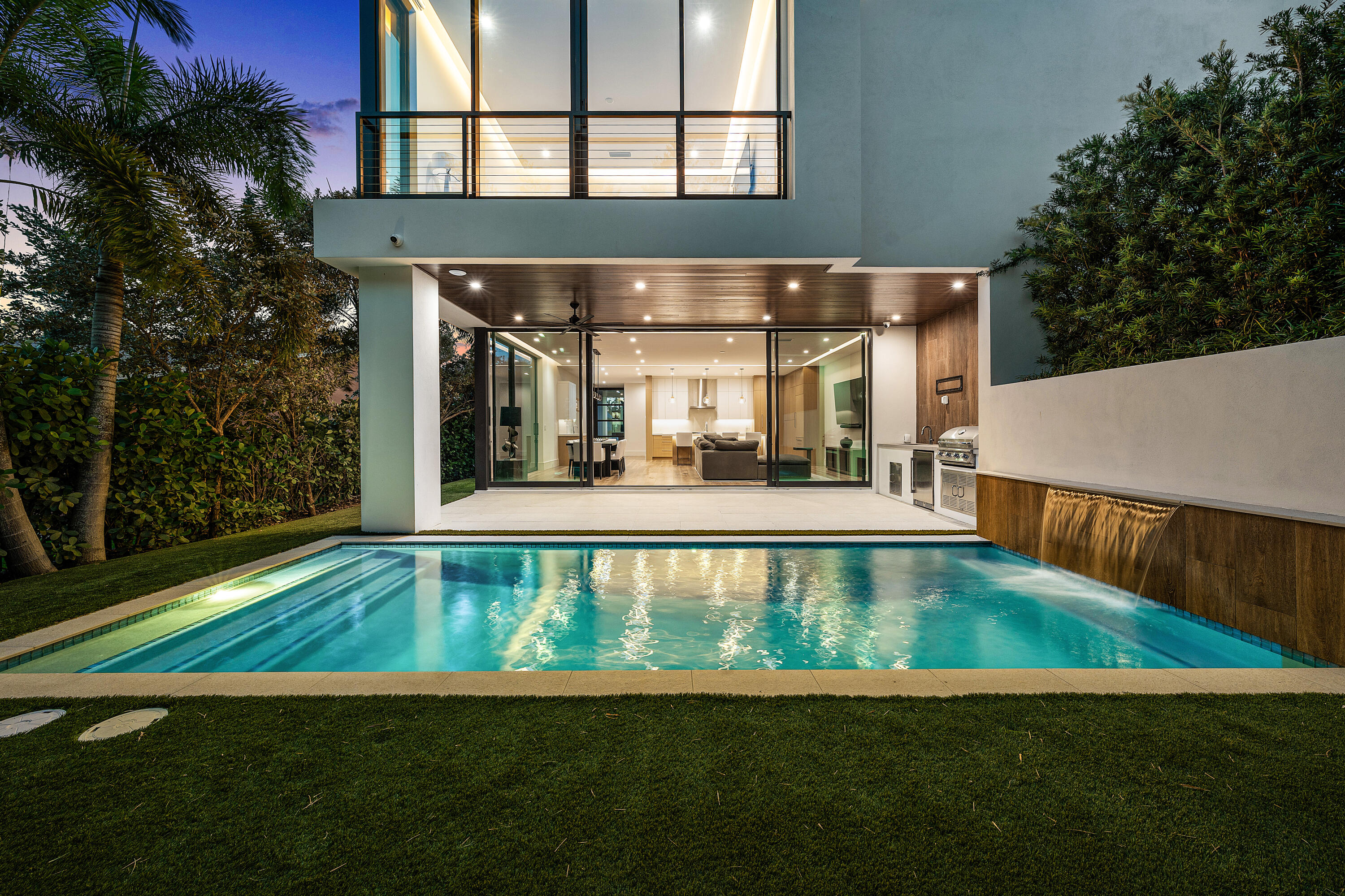 320 Northeast Wavecrest Way Boca Raton, FL 33432 - Photo 31 of 65 a view of a house with a swimming pool