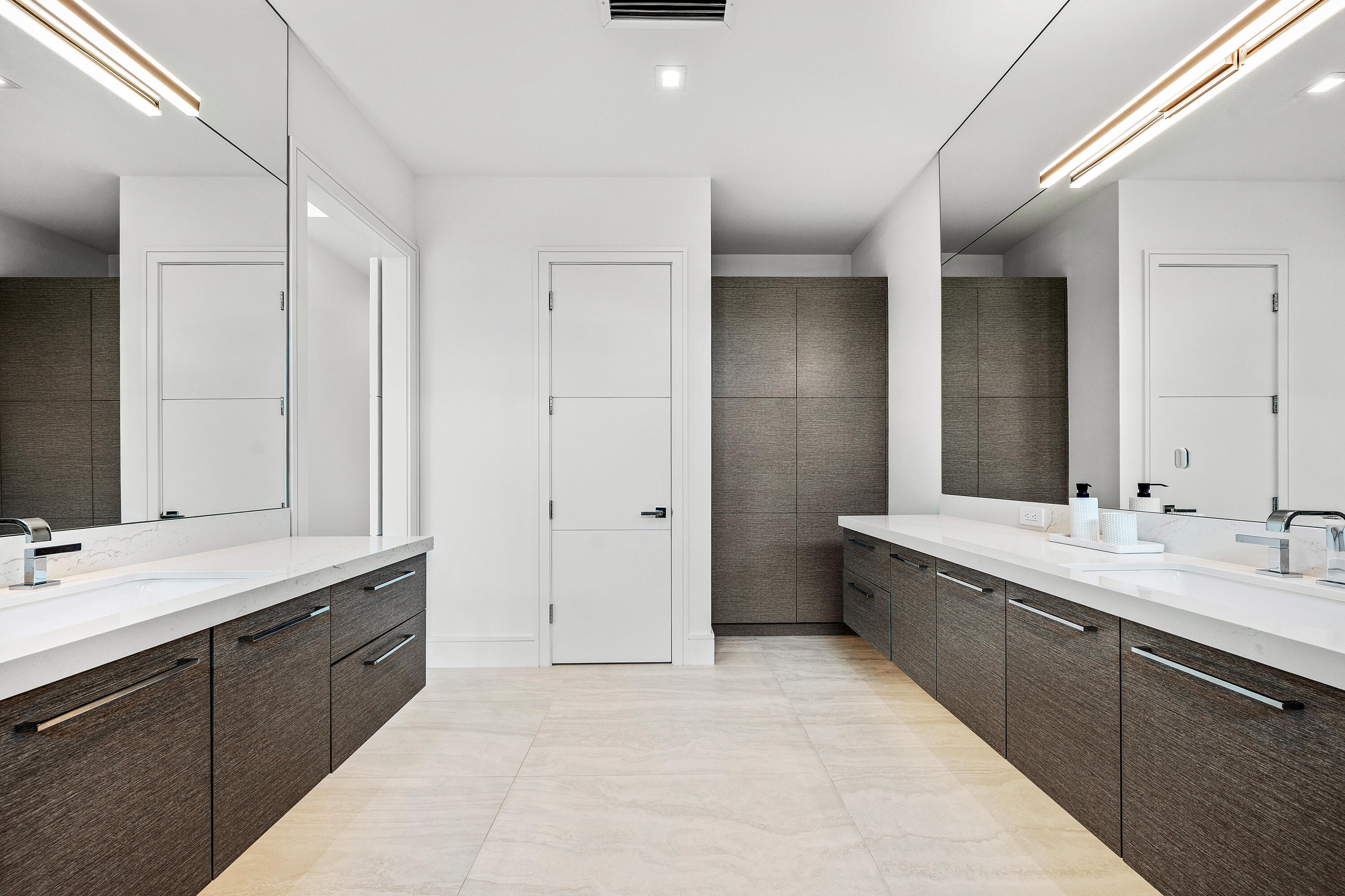 320 Northeast Wavecrest Way Boca Raton, FL 33432 - Photo 47 of 65 a spacious bathroom with a double vanity sink mirror and