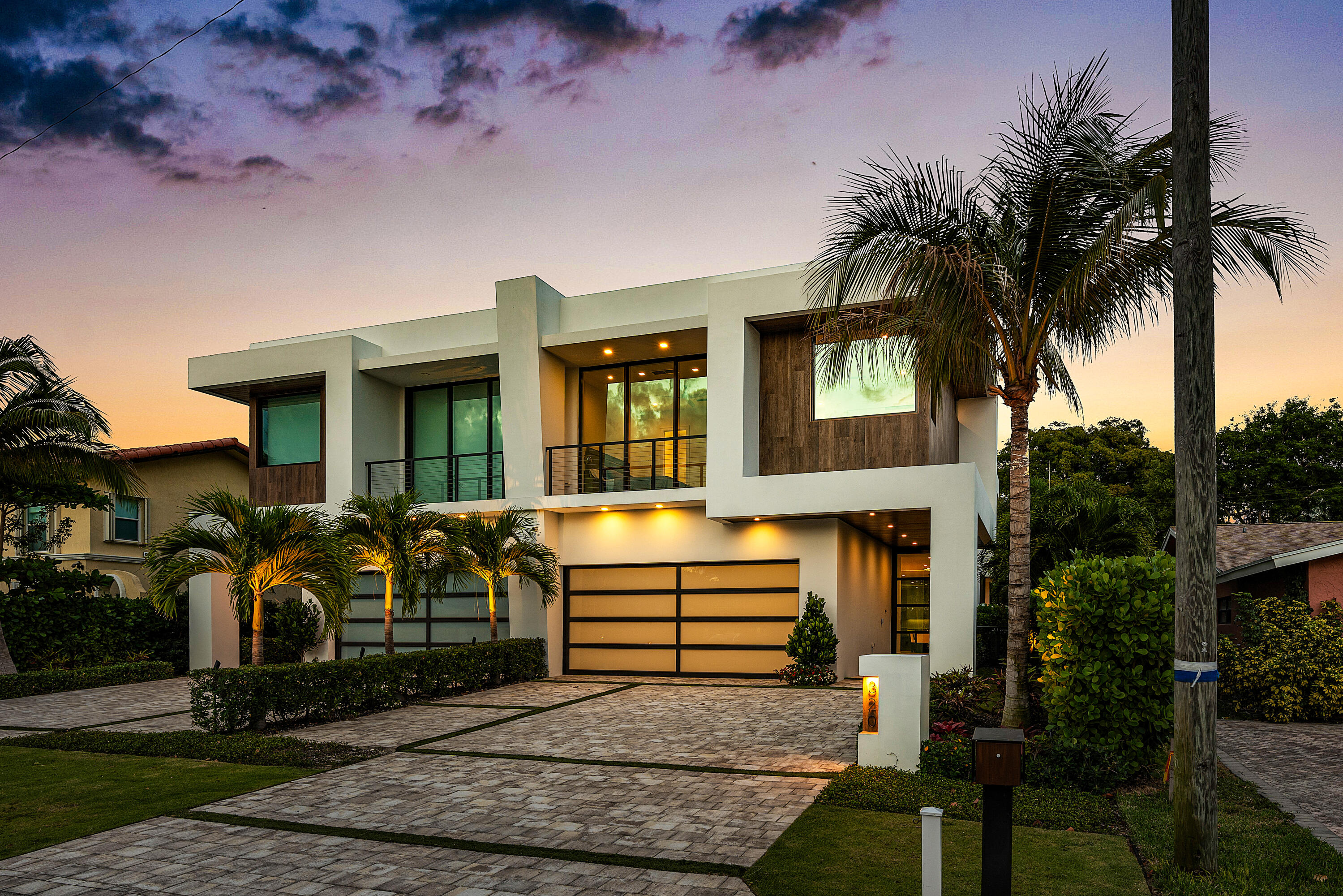 320 Northeast Wavecrest Way Boca Raton, FL 33432 - Photo 5 of 65 a front view of a house with garden