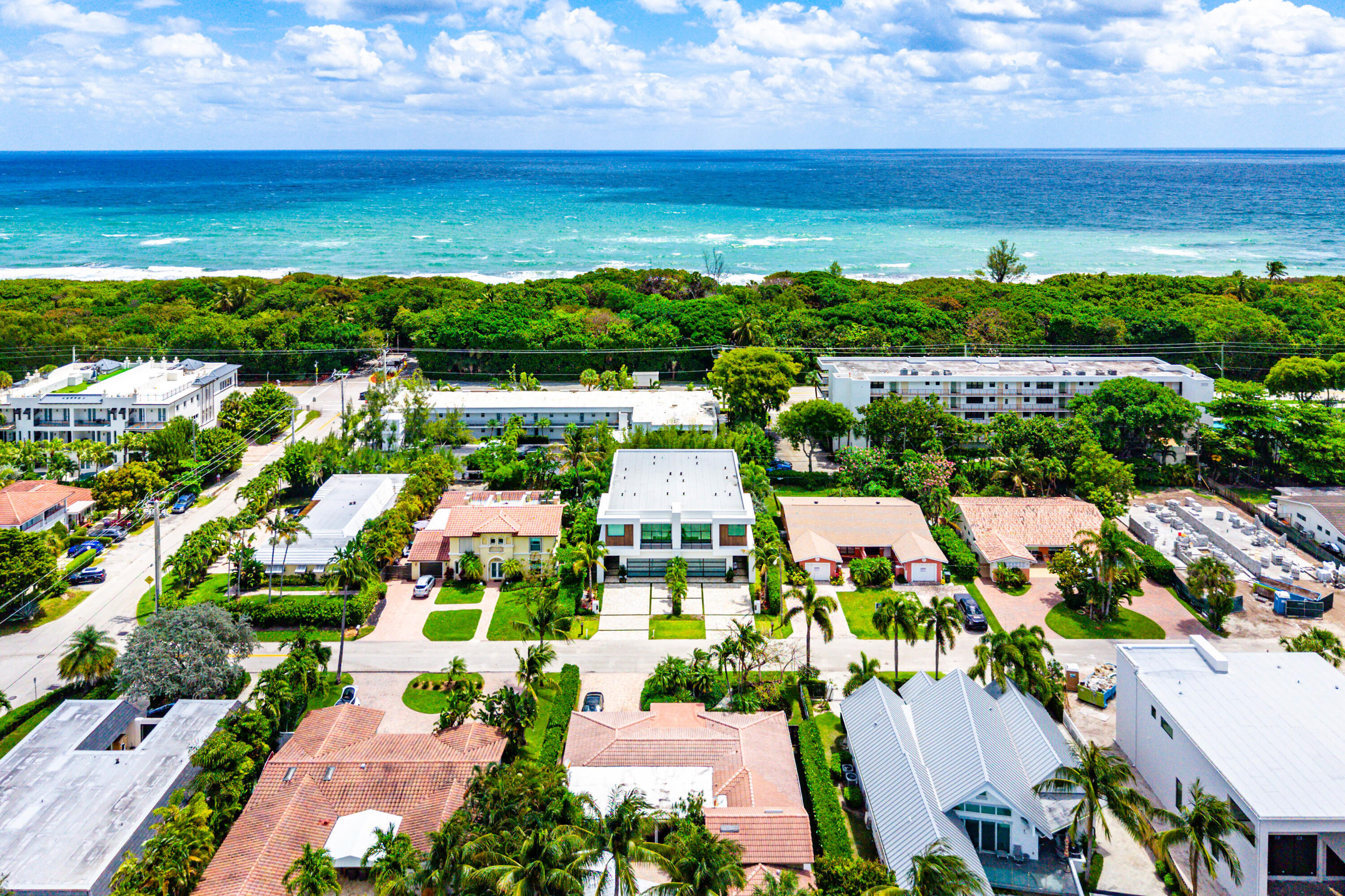 320 Northeast Wavecrest Way Boca Raton, FL 33432 - Photo 62 of 65 an aerial view of residential building and ocean view