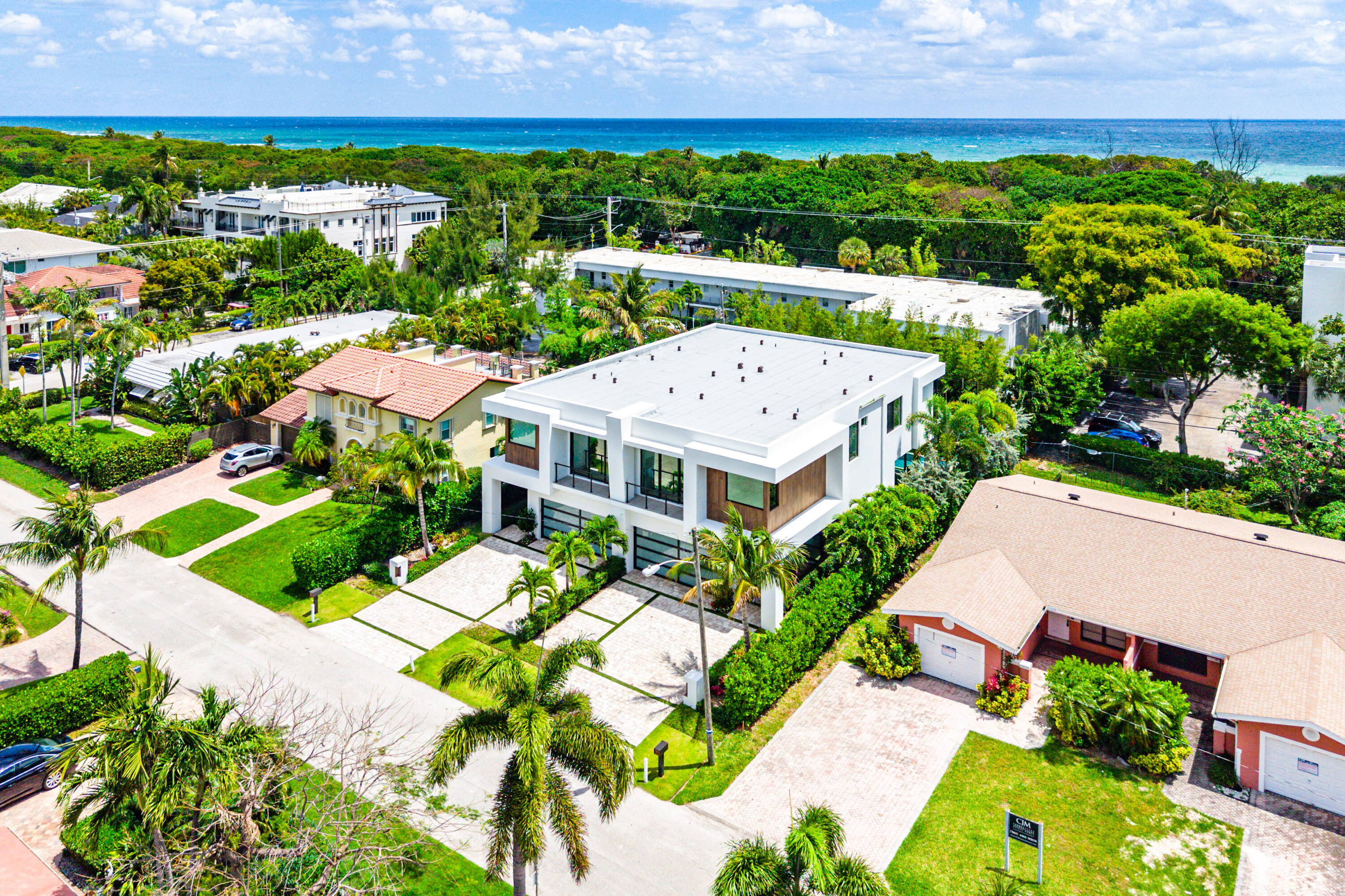 320 Northeast Wavecrest Way Boca Raton, FL 33432 - Photo 64 of 65 an aerial view of a house with a garden