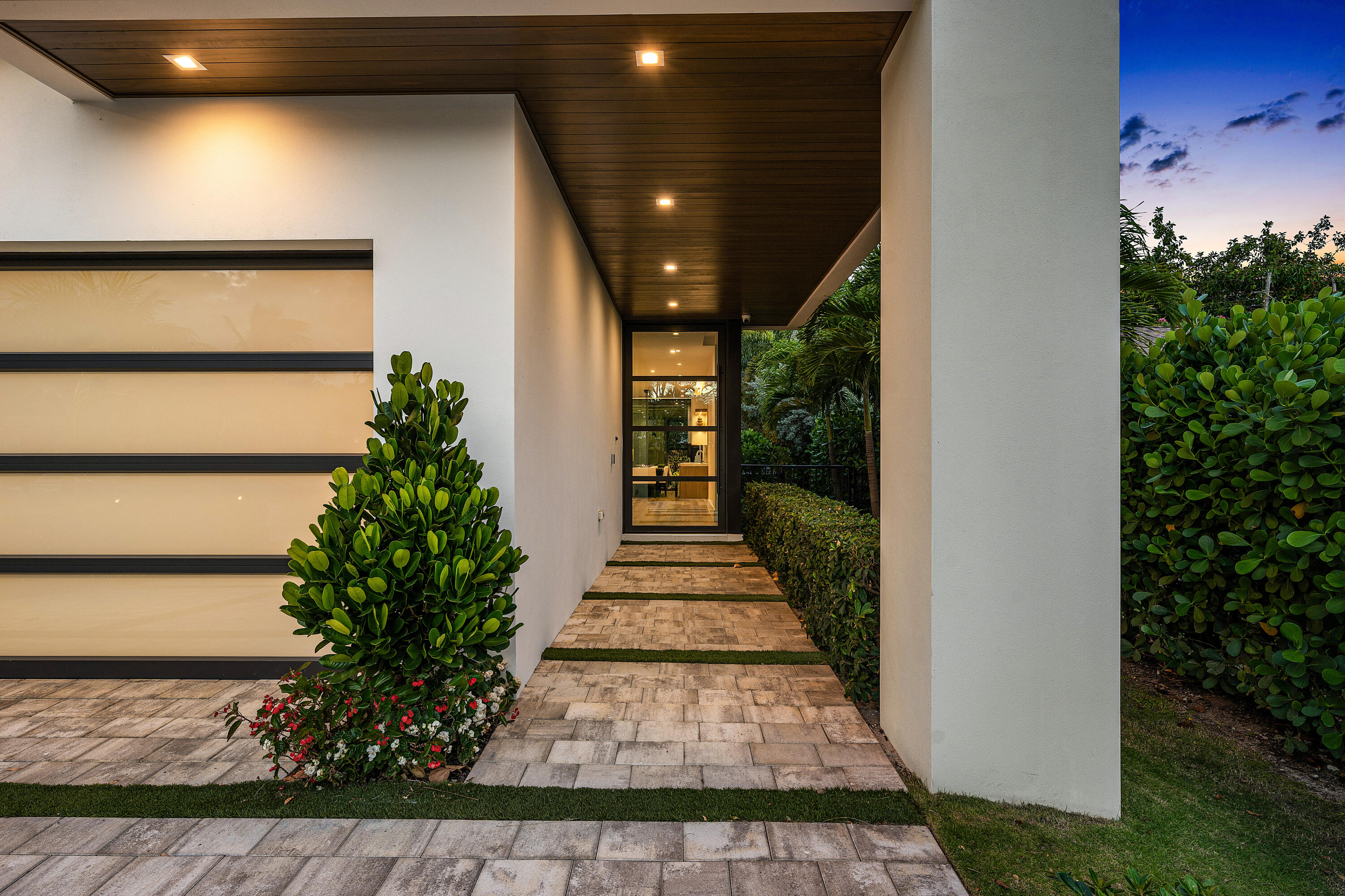 320 Northeast Wavecrest Way Boca Raton, FL 33432 - Photo 7 of 65 a view of a entryway door both side of the house