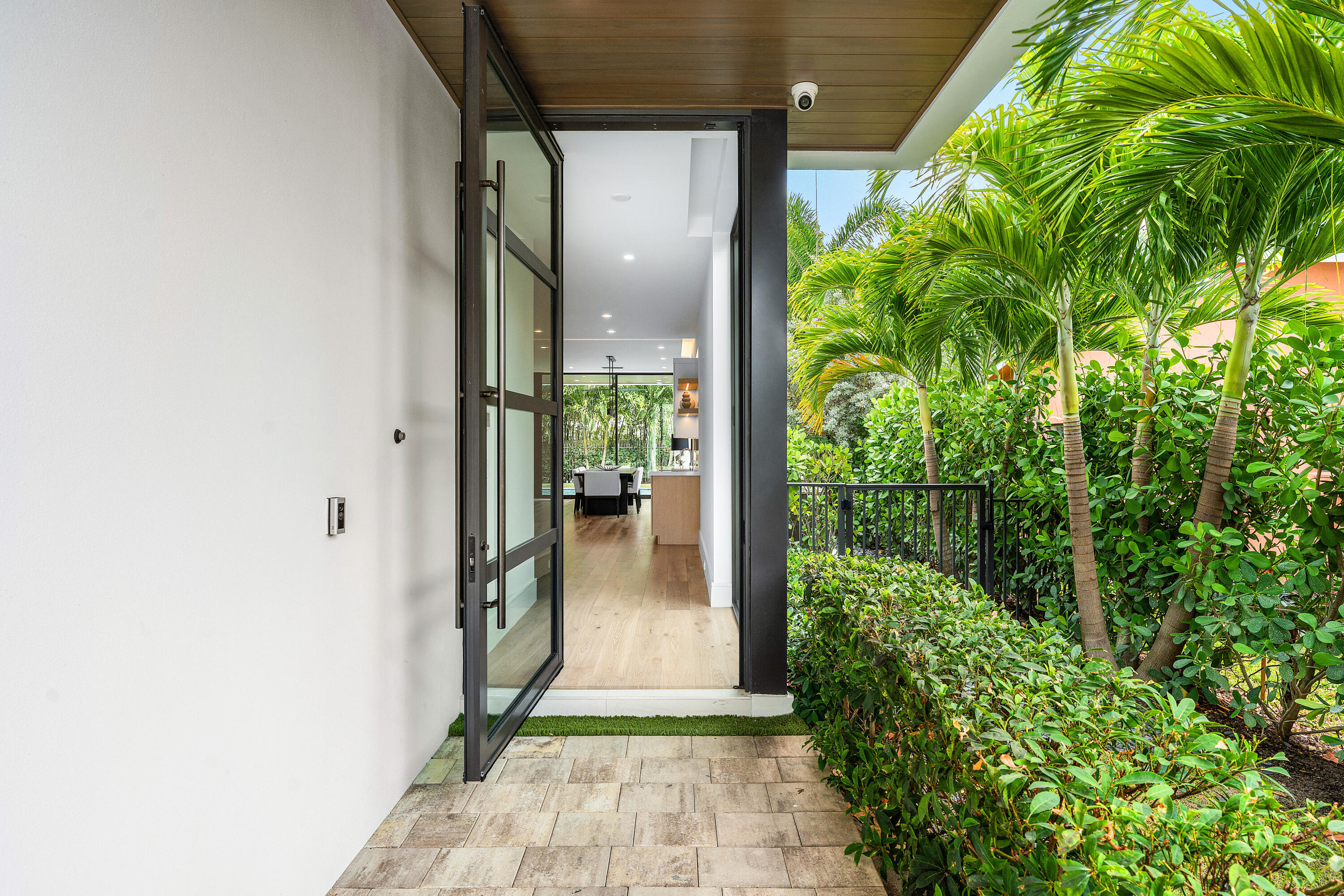 320 Northeast Wavecrest Way Boca Raton, FL 33432 - Photo 8 of 65 a view of a glass door with a glass door
