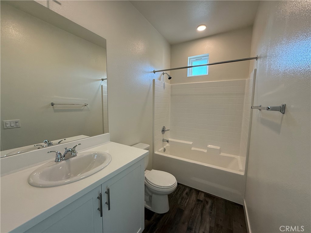 78 Bigsby Drive Stanton, CA 90680 - Photo 8 of 9 a bathroom with a sink toilet tub and shower