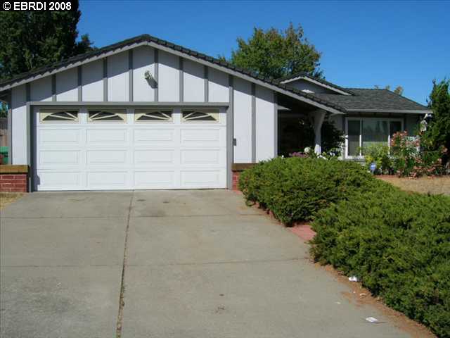 1056 Sandpoint Drive Rodeo, CA 94572 - Photo 1 of 1 a house with trees in front of it
