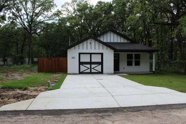 front view of a house with a yard