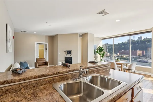 a living room with furniture and a rug