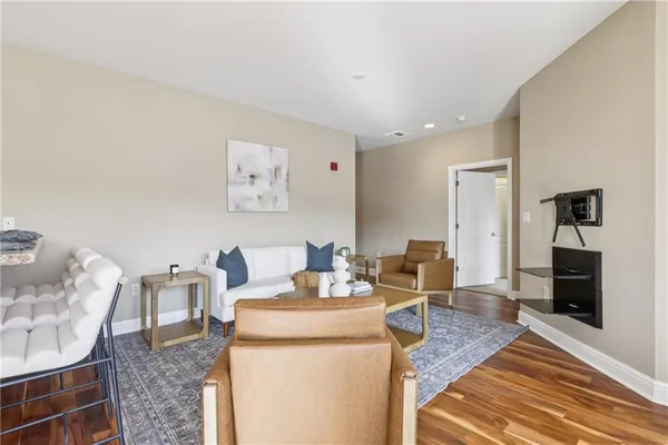 a kitchen with granite countertop a stove and a wooden floors