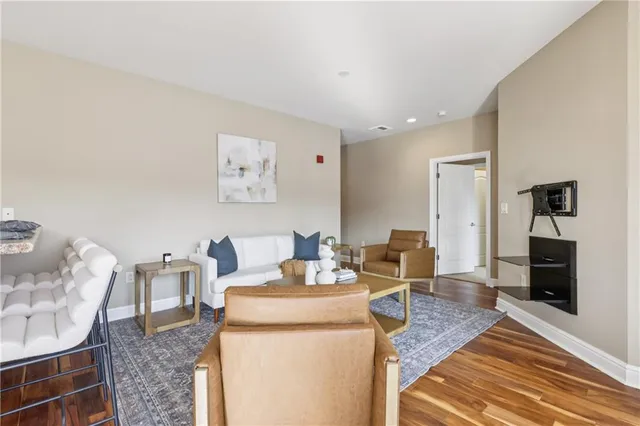 a spacious bedroom with a bed and a window