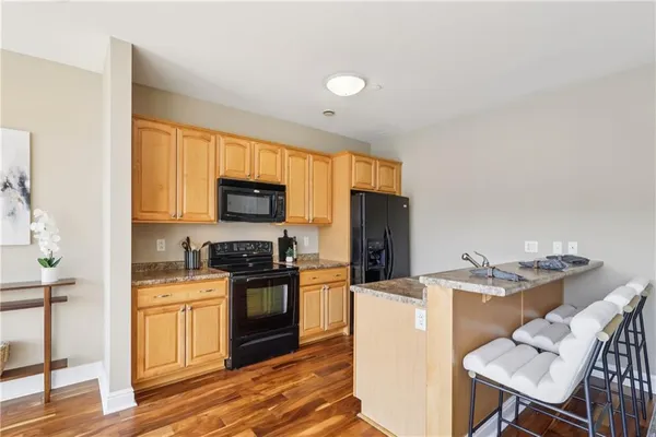 a spacious bedroom with a bed and a window