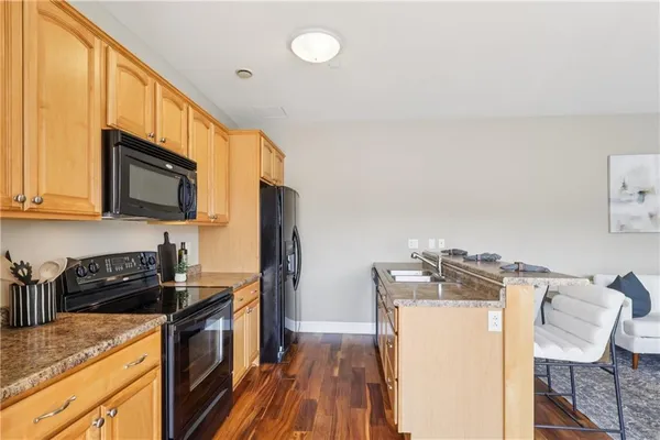 a bedroom with a bed and painting on the wall