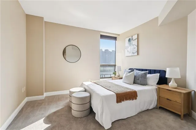 a bedroom with a bed and a cabinets