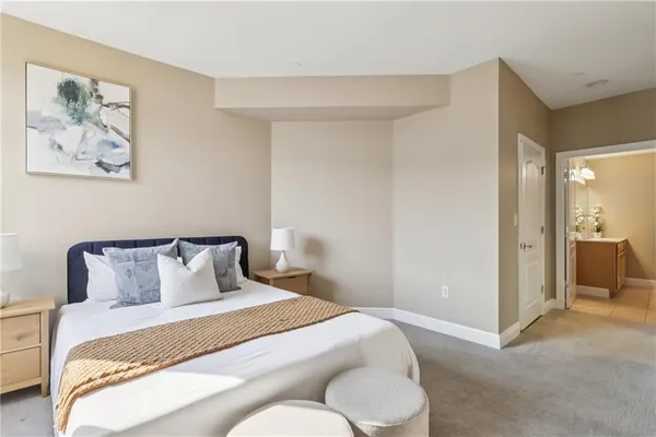 a bedroom with a bed and a cabinets