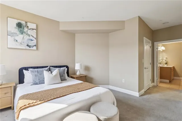 a bathroom with a sink mirror toilet and bathtub