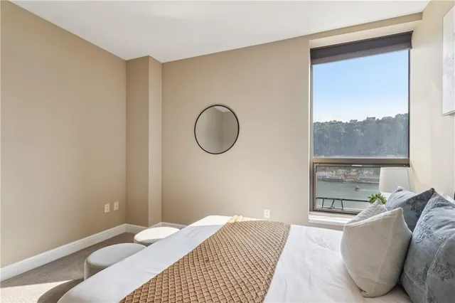 a bathroom with a tub sink and a mirror