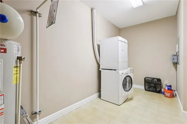 a white toilet sitting next to a white wall