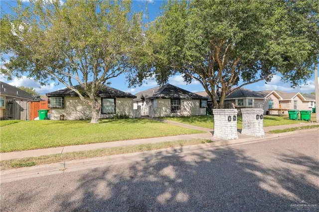 a view of house with outdoor space and tree s