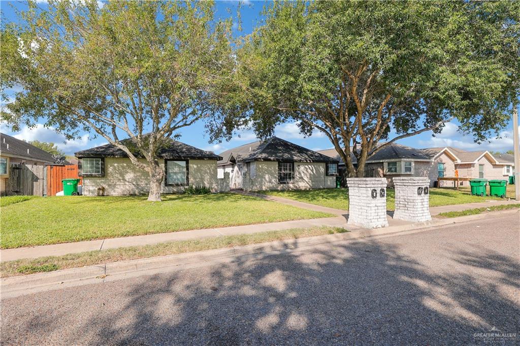 a view of house with outdoor space and tree s