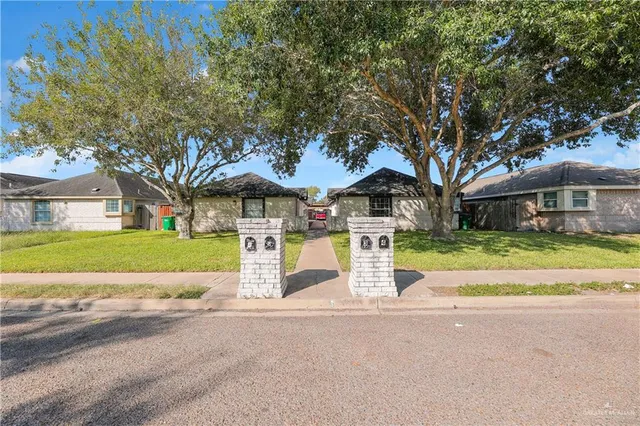 a view of house with outdoor space and tree s