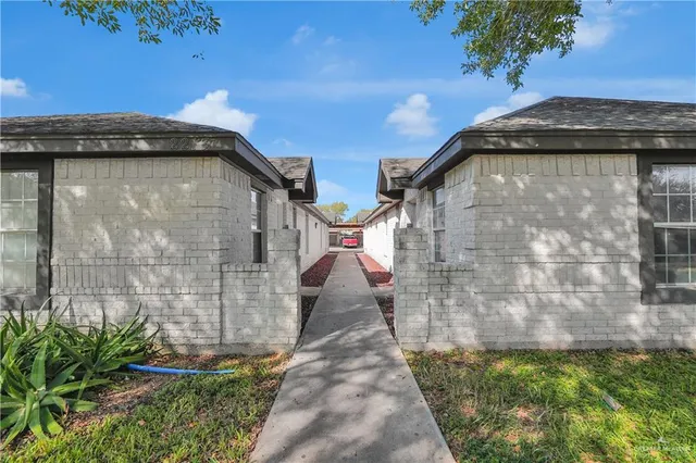 a view of a pathway along the building