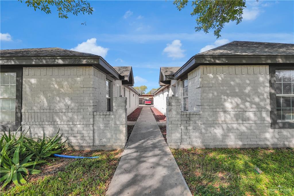 2213 North Dahlia Street, Unit 2 Pharr, TX 78577 - Photo 4 of 18 a view of a pathway along the building