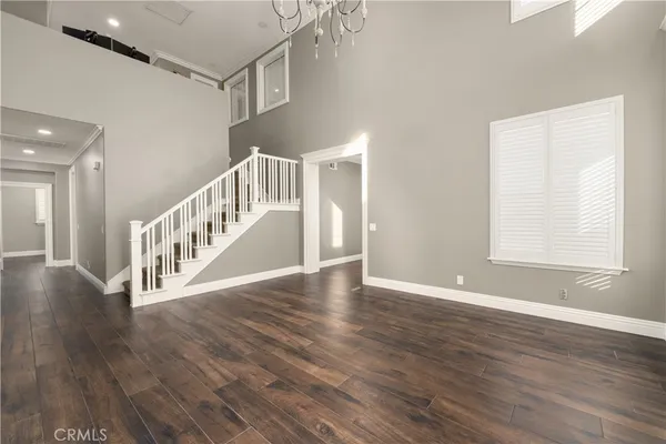 a view of an entryway with wooden floor