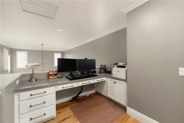 a workspace with furniture and mirror