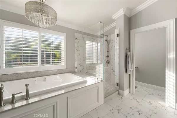 a bathroom with a tub sink and shower
