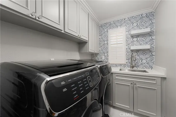 a kitchen with a stove and a white cabinet