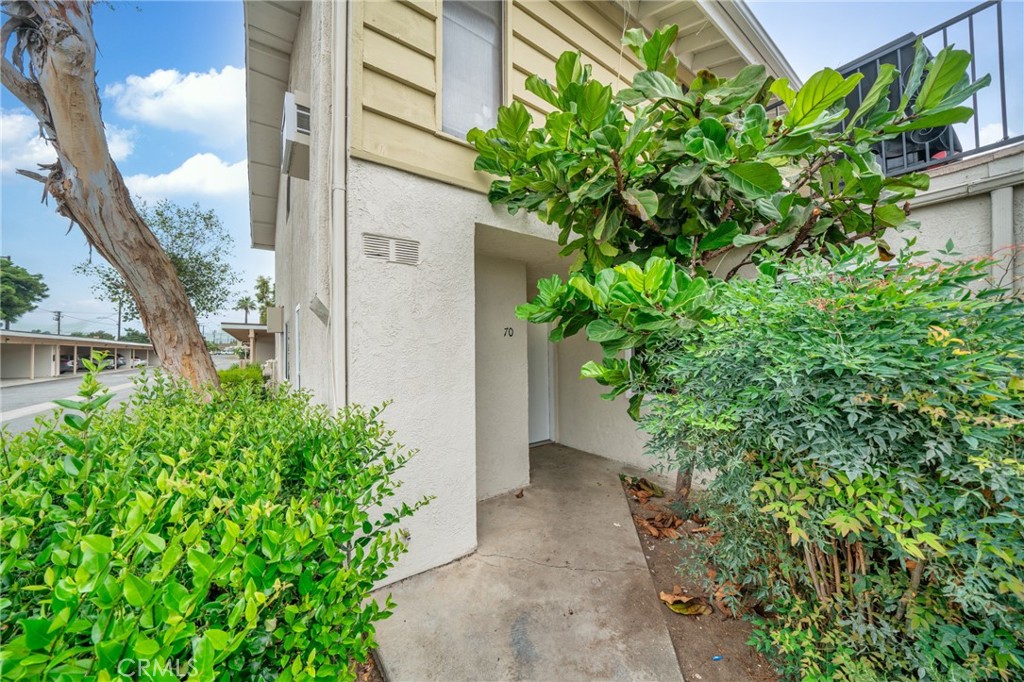 1192 Mitchell Avenue, Unit 70 Tustin, CA 92780 - Photo 1 of 29 a view of a garden with pathway