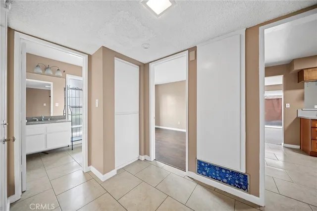 a view of a bathroom with sink and shower