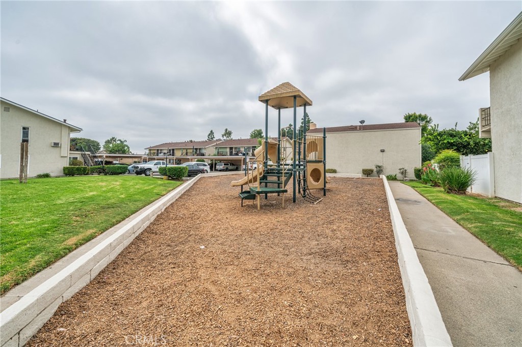 1192 Mitchell Avenue, Unit 70 Tustin, CA 92780 - Photo 26 of 29 a view of a backyard with sitting area