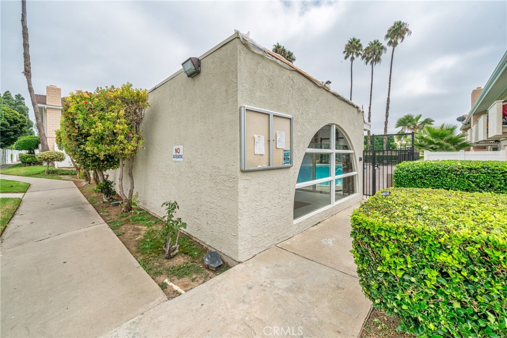 1192 Mitchell Avenue, Unit 70 Tustin, CA 92780 - Photo 27 of 29 a house view with a garden space