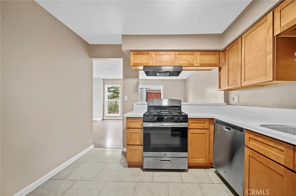 a kitchen with a stove and a sink