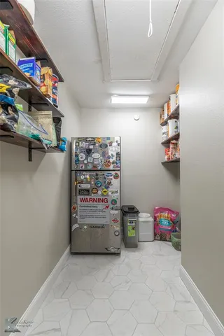 a view of storage and utility room