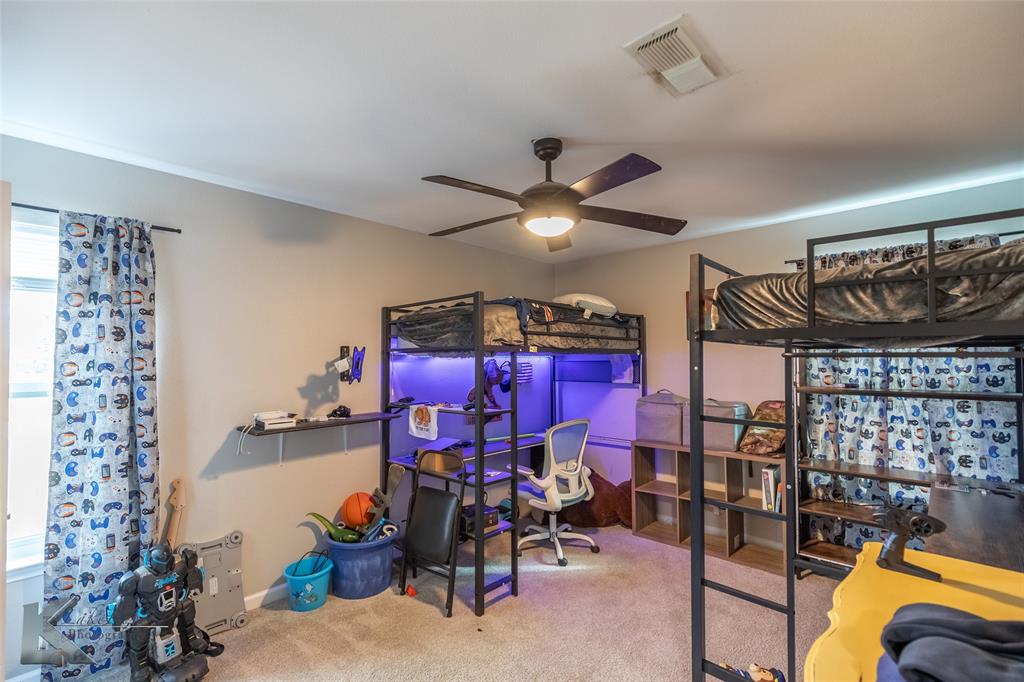 917 County Road 3798 Springtown, TX 76082 - Photo 20 of 40 a view of a room with gym equipment
