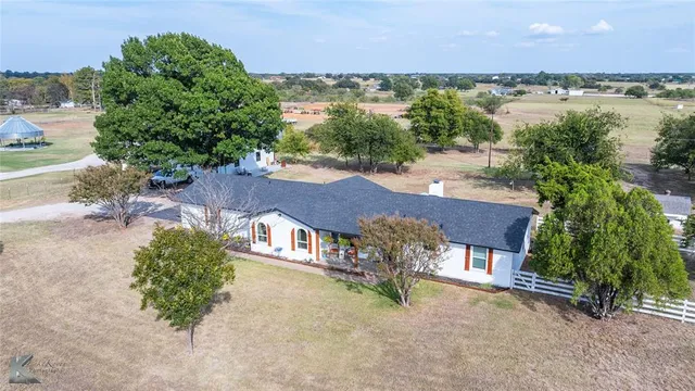 an aerial view of a house with garden space and outdoor space