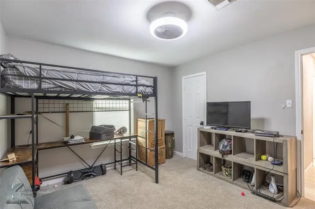 a view of a livingroom with furniture and a flat screen tv